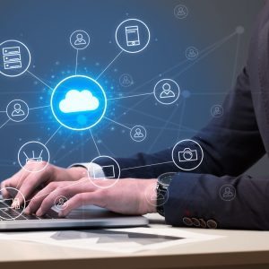 Businessman hand typing with cloud technology system and office symbol concept