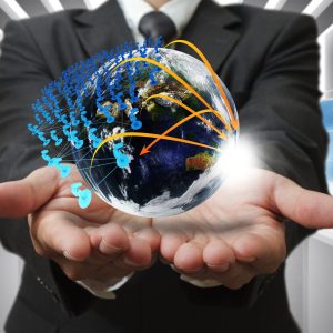 Business man hand holds globe and social network"Elements of this image furnished by NASA"
